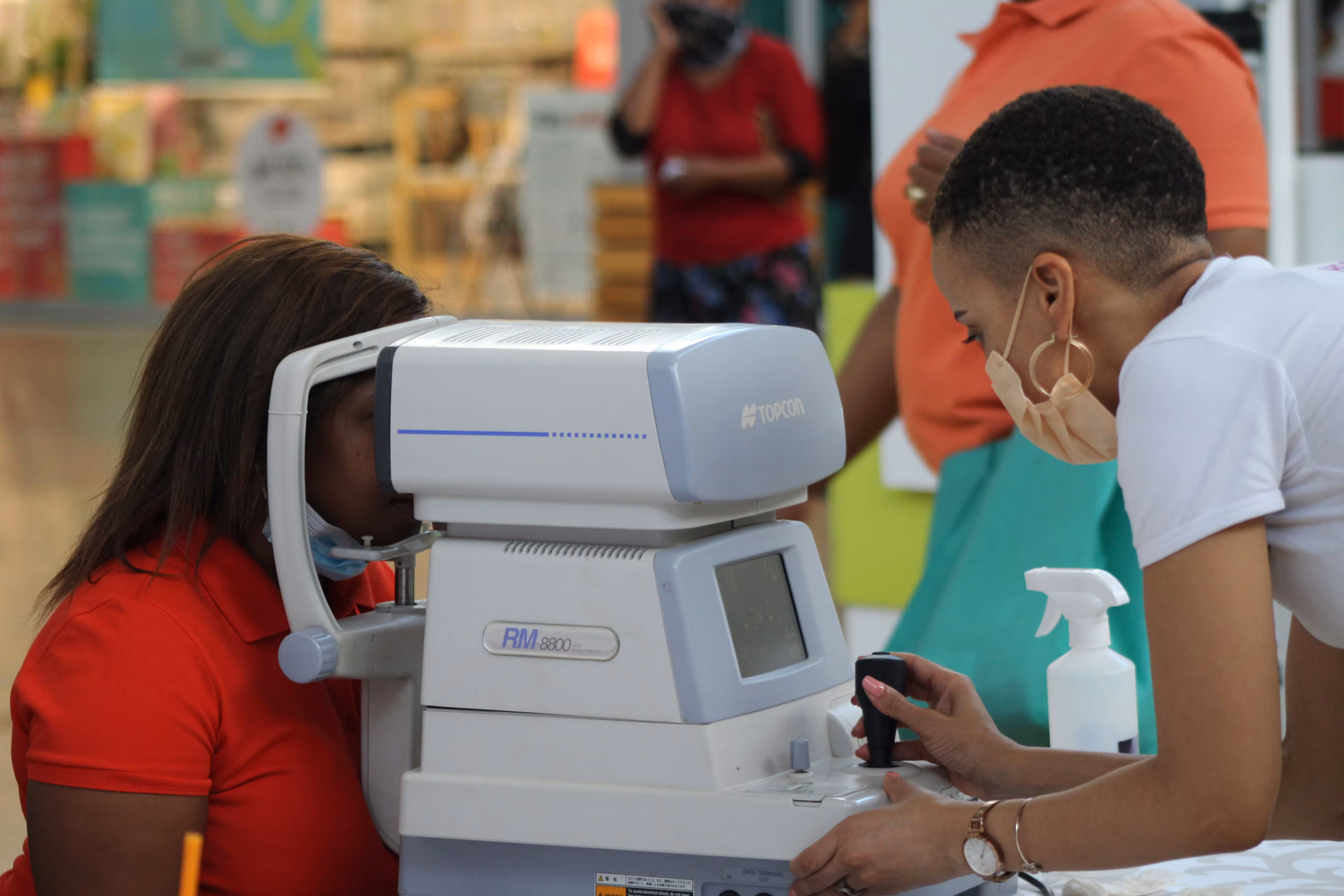 Specialist performing a digital slit-lamp eye examination at Neura-Sight